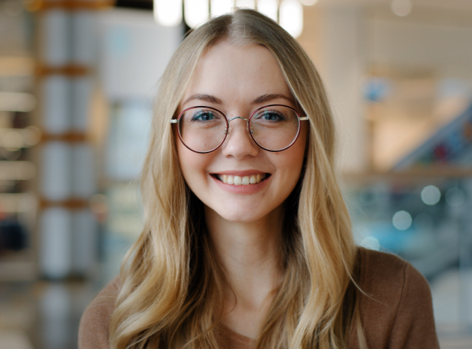 Woman with glasses smiling